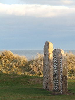 Modern standing stones three feature the poem 'The Wild Geese' by Violet Jacob.  Courtesy of wikimedia commons.